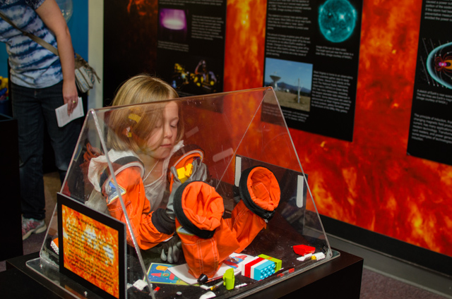 Child in the Space Weather exhibit.